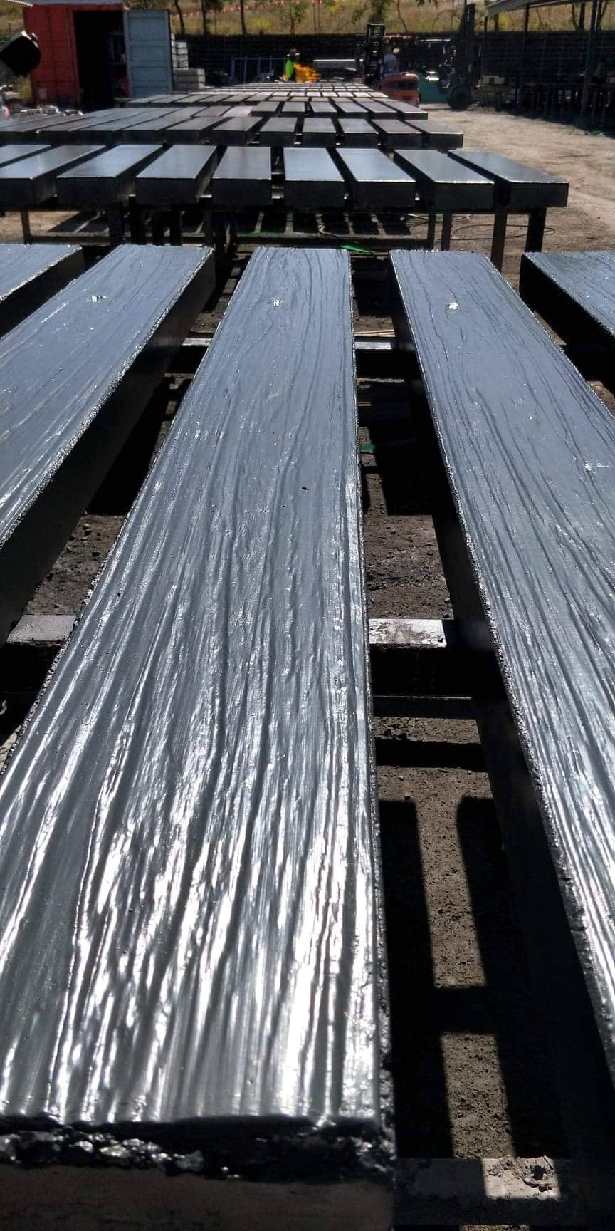Charcoal timber-look concrete sleepers showing the texture